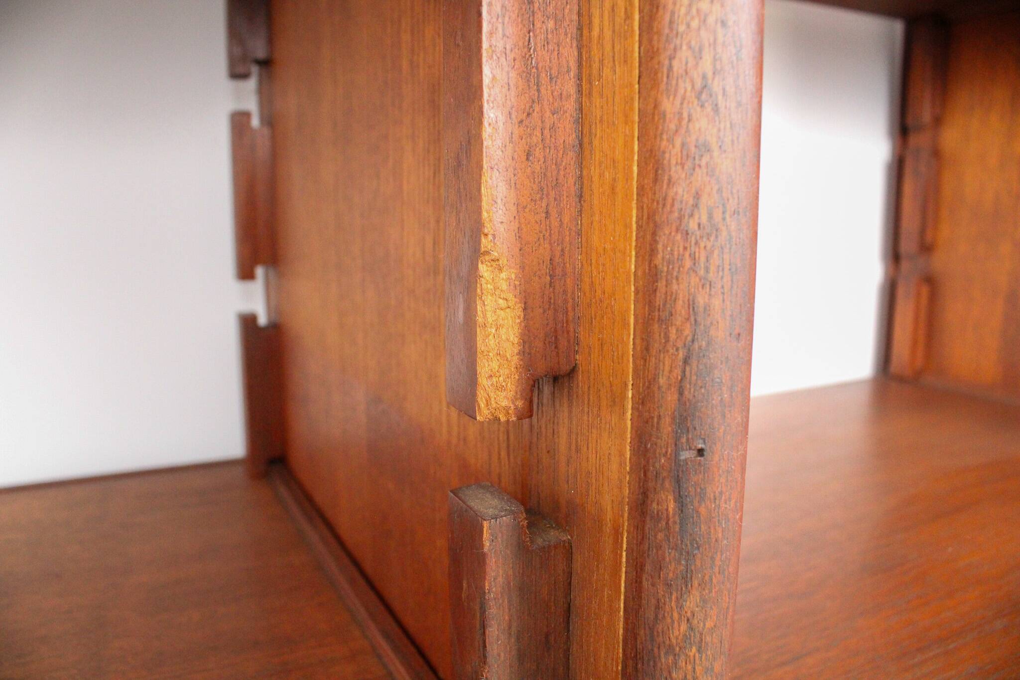 A vintage mid-century teak Gianfranco Frattini style bookcase room divider