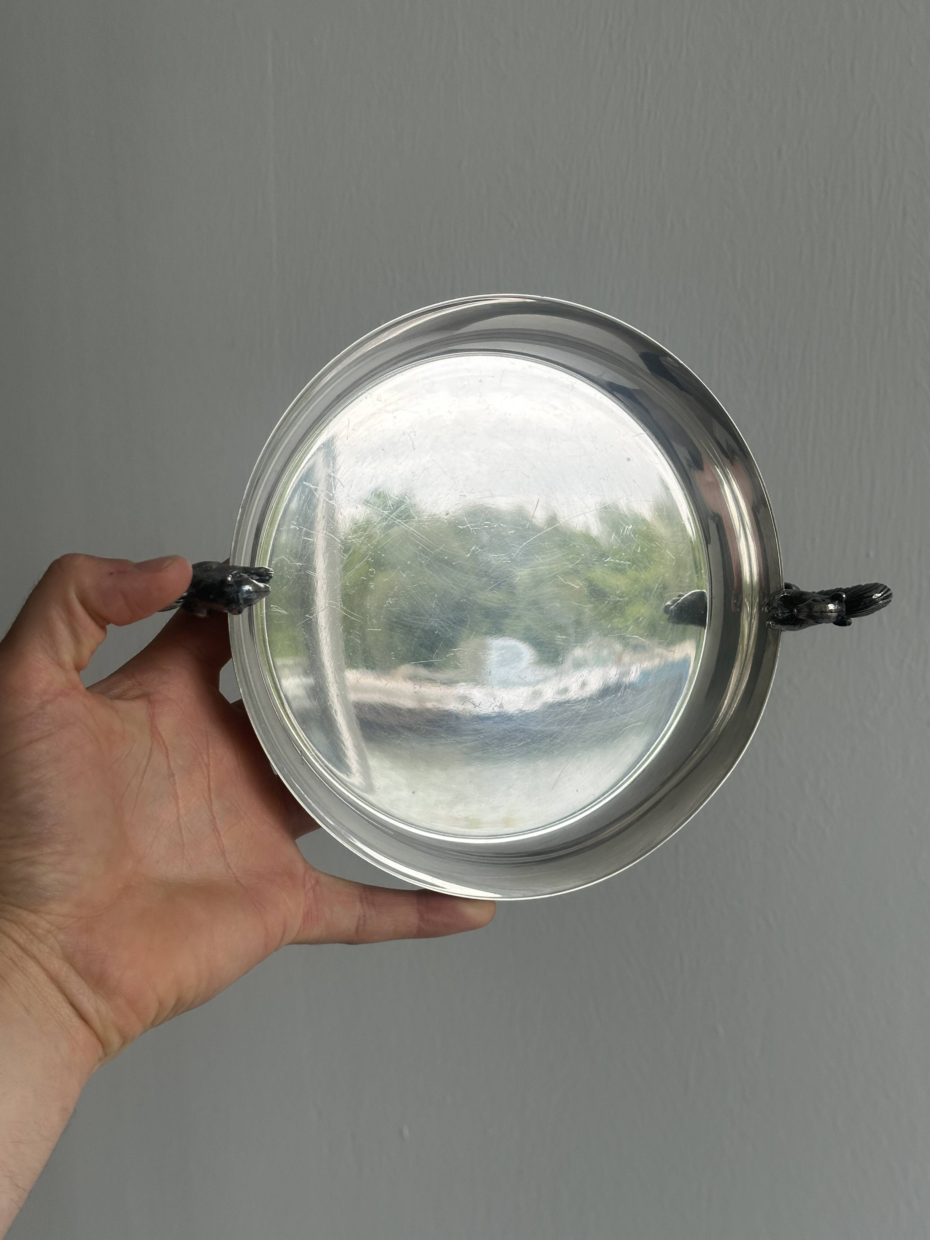 Small shiny silver metal dish