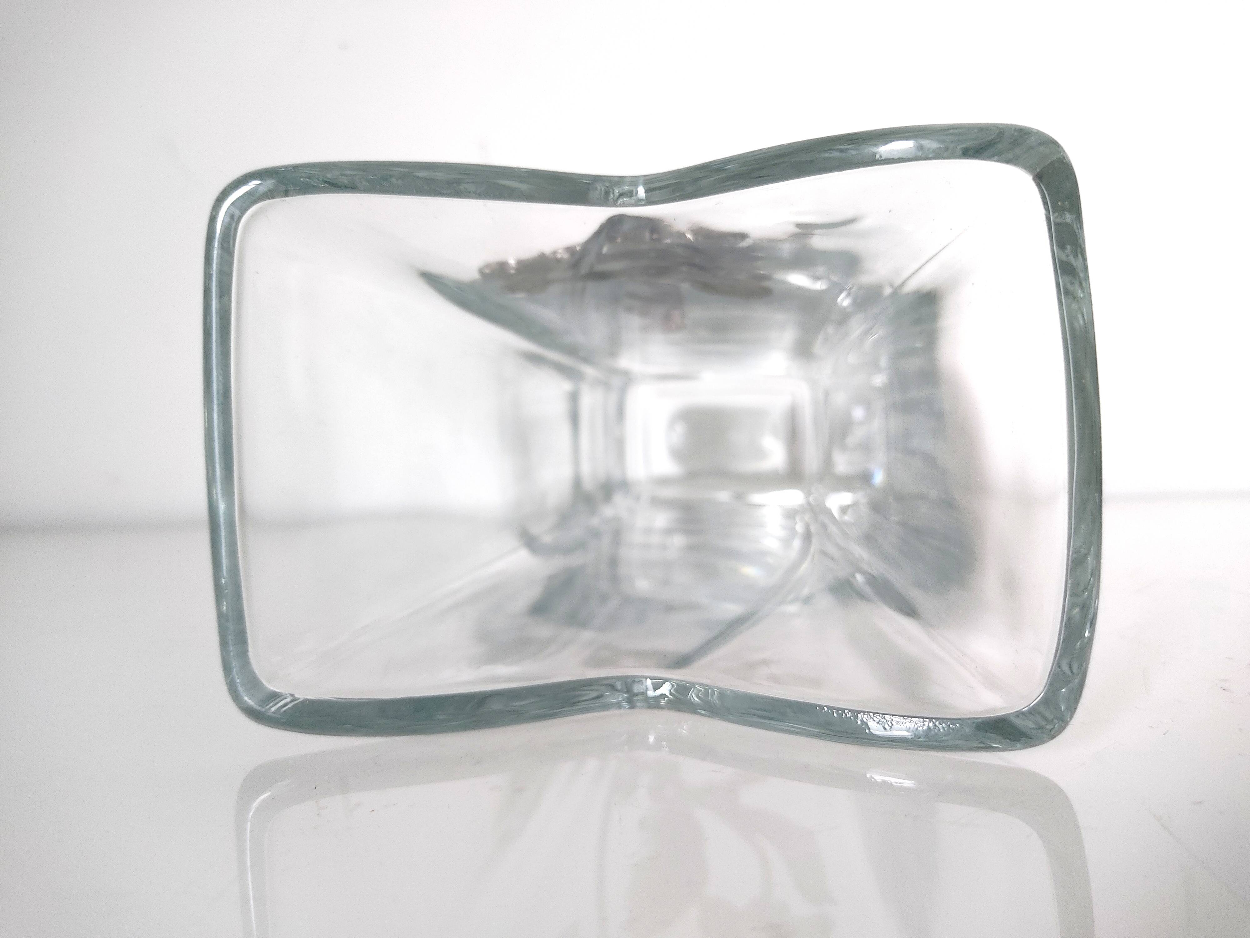 Glass vase with metal flower application