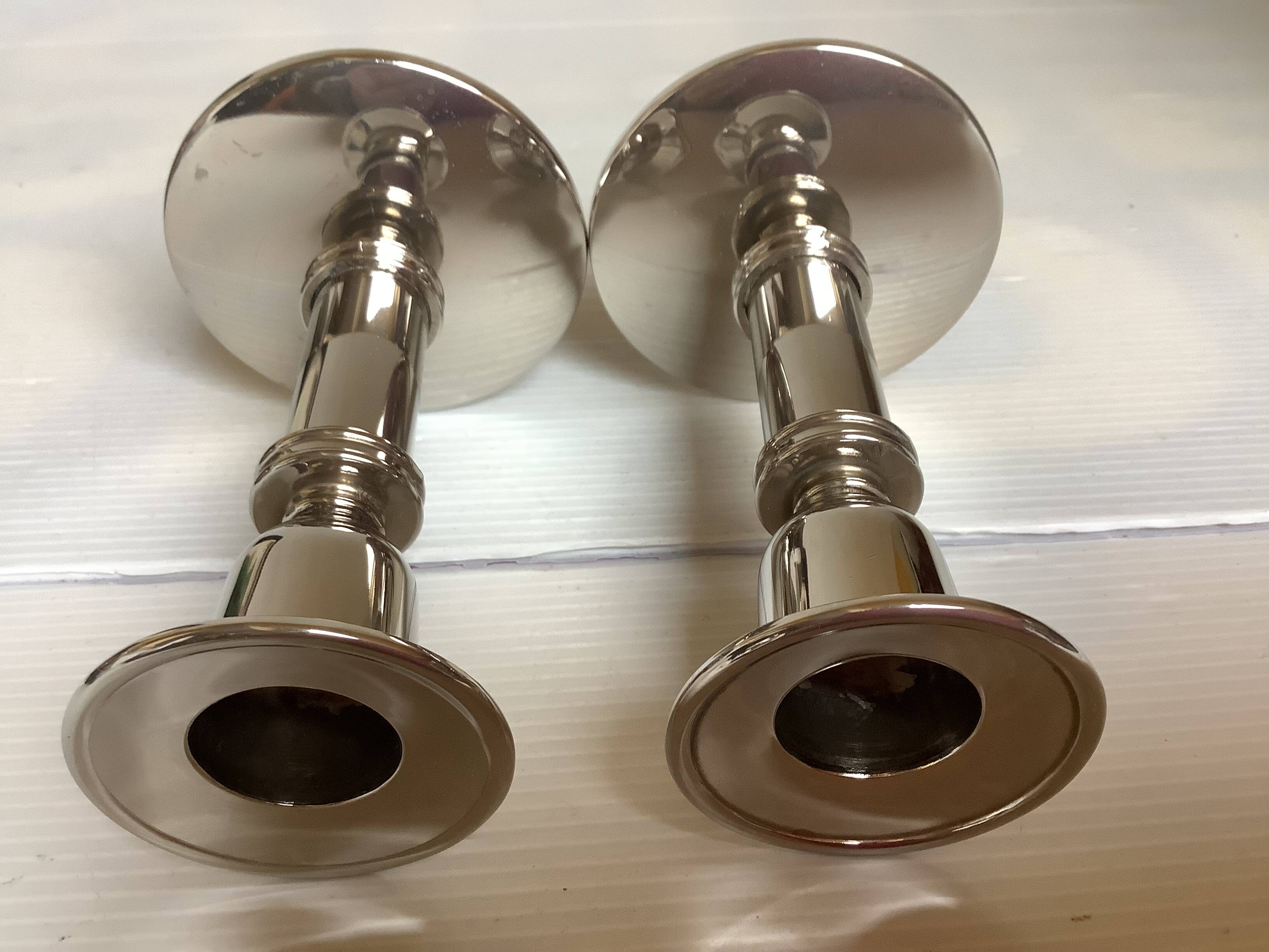 Pair of silver metal candlesticks