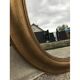 Gold oval mirror 64cm x 54cm