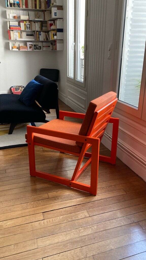 Orange designer armchair by Terence Conran