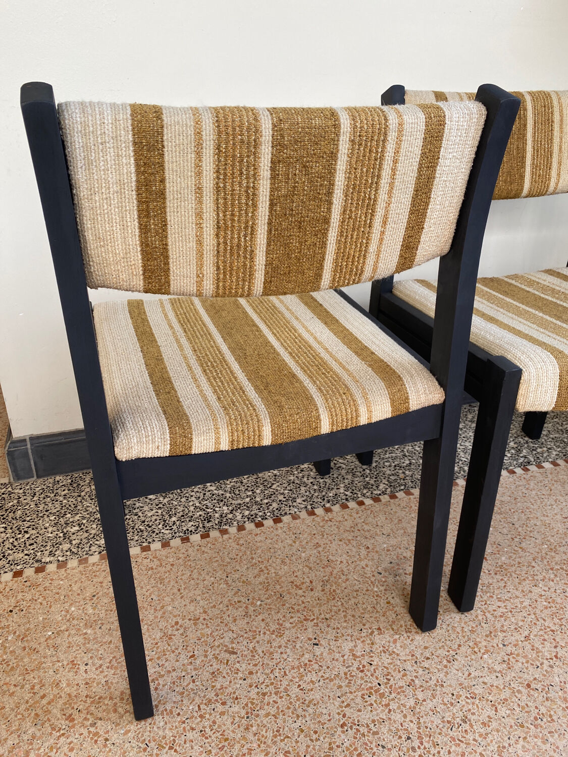 2 wooden chairs and vintage fabric