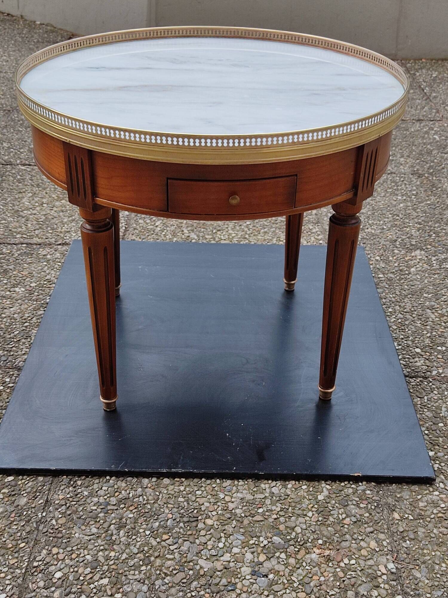 French hot water bottle table in Louis XVI style (1890); marble top and bronze gallery