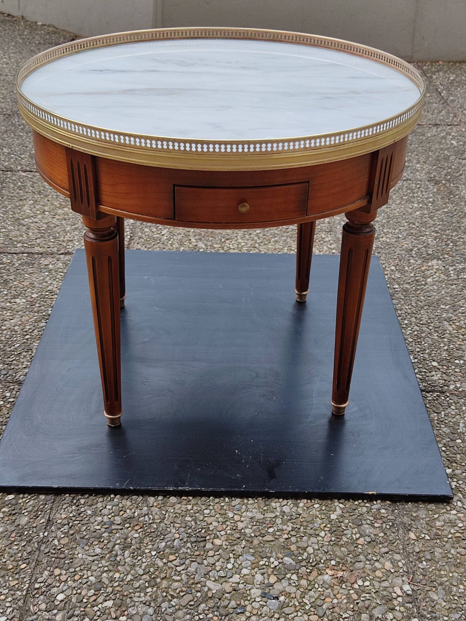French hot water bottle table in Louis XVI style (1890); marble top and bronze gallery