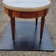 French hot water bottle table in Louis XVI style (1890); marble top and bronze gallery