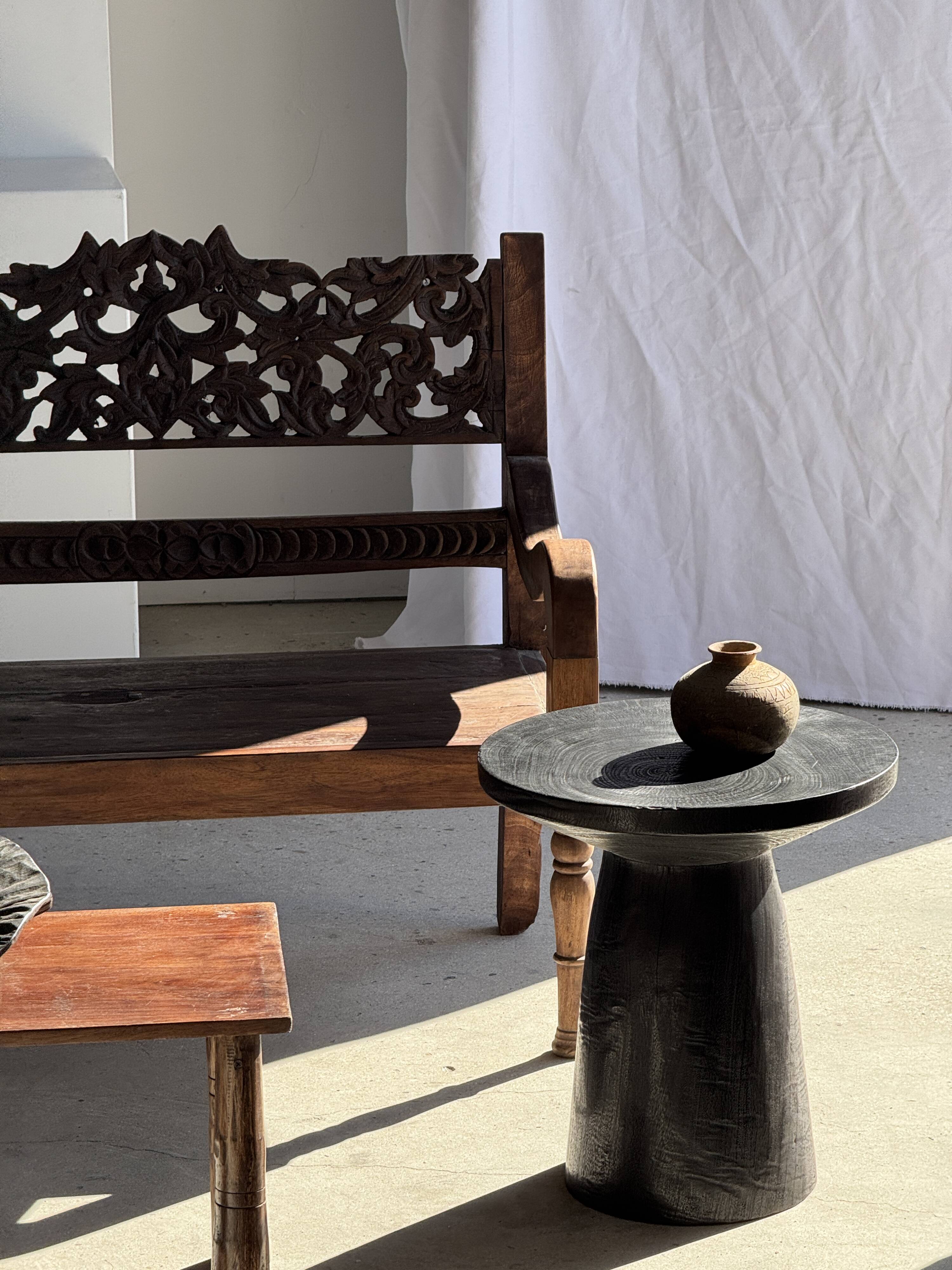 Black solid mango side table (monoxyle) with conical legs