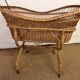 Rattan cradle on wheels