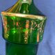 Bouteille en verre vert et dorure style Louis
