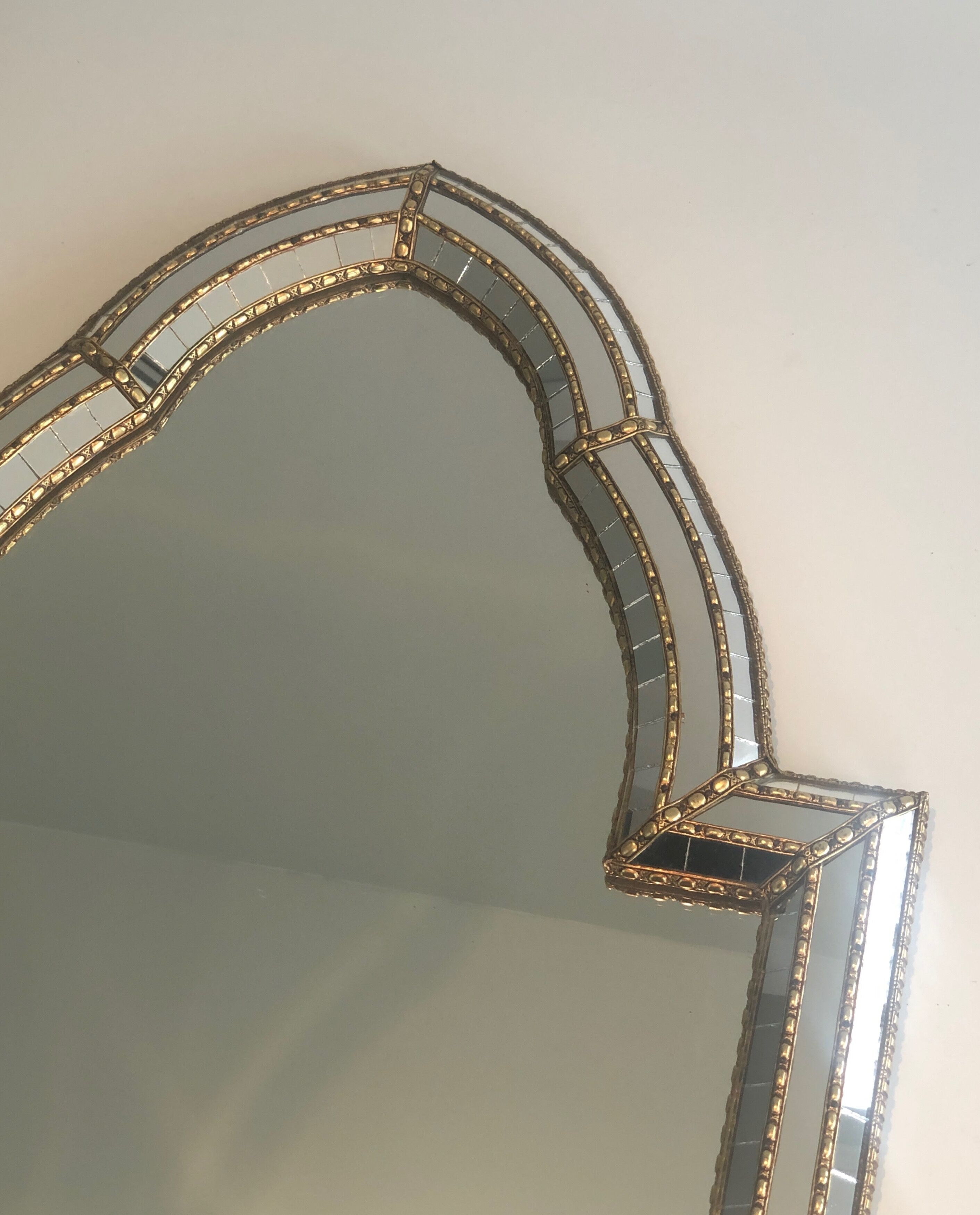 Mirror consisting of multi-faceted mirrors and brass garlands, French work, around 1970