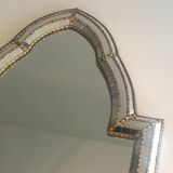 Mirror consisting of multi-faceted mirrors and brass garlands, French work, around 1970