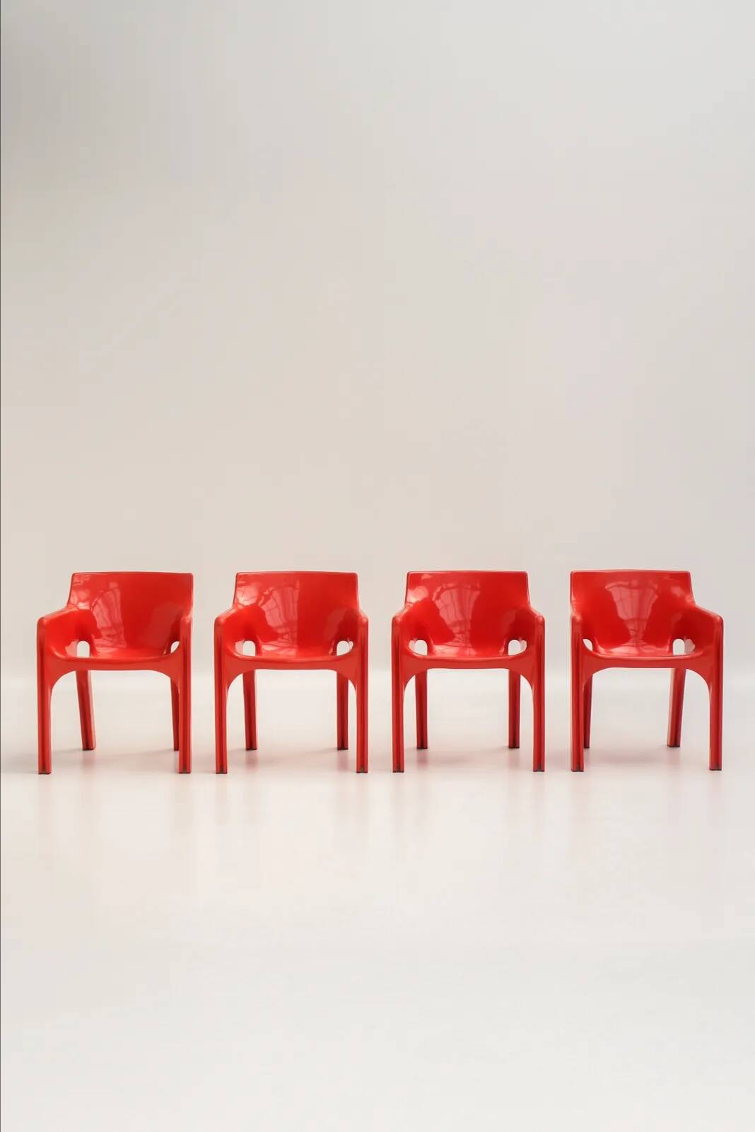 Set of 4 red "Gaudi" armchairs by Vico Magistretti for Artemide