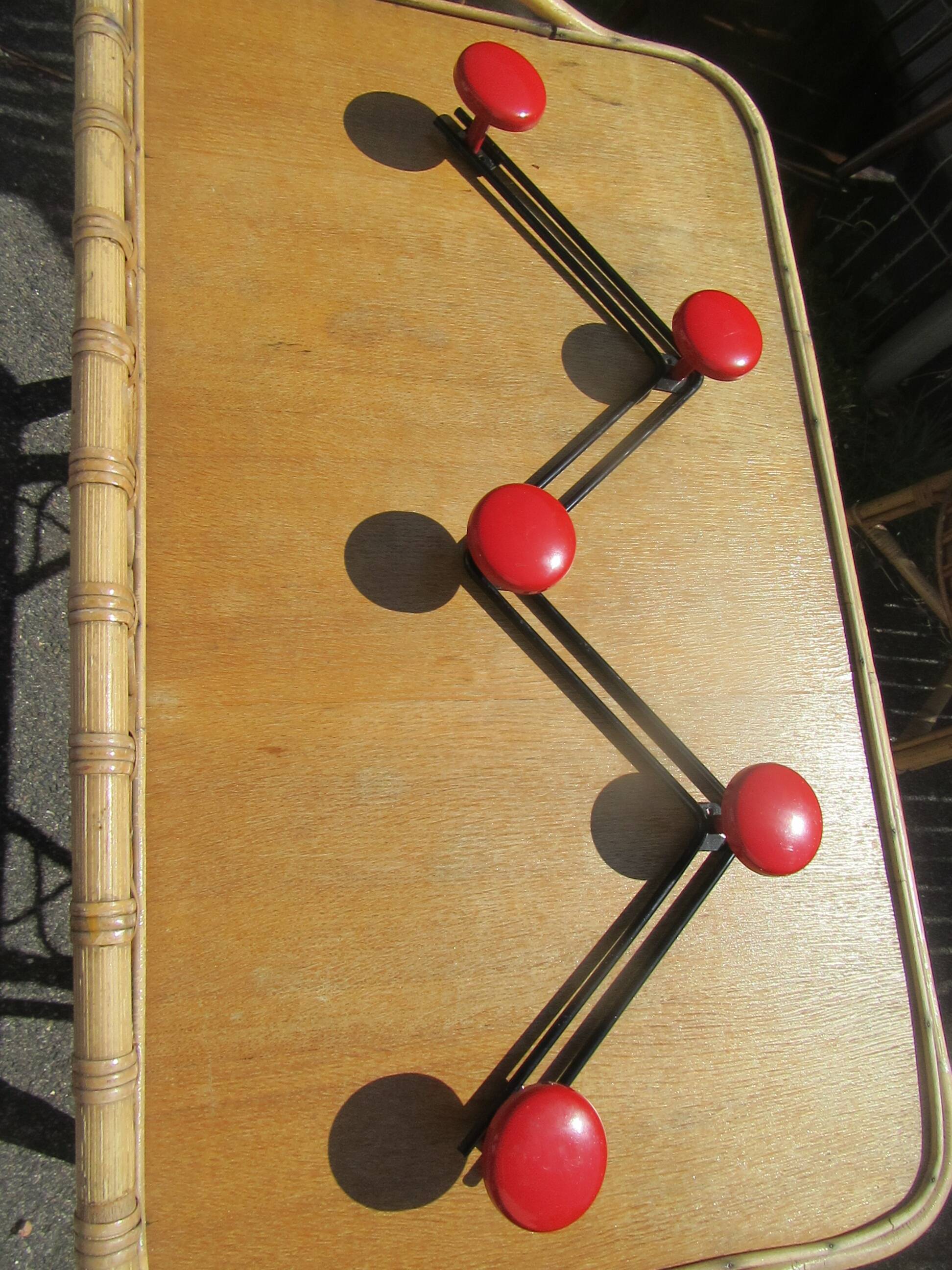 vintage black and red iron coat rack