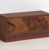 Small Japanese cabinet with sliding doors, Kabuki decoration, made of paulownia wood, early Showa period, circa 1926–1970.