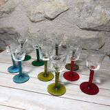 Antique and rare! Sold in a set of 12 colorful twisted stemmed glasses engraved with flowers and leaves