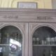 Antique carved buffet display cabinet with gray patina