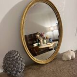 Old golden oval mirror