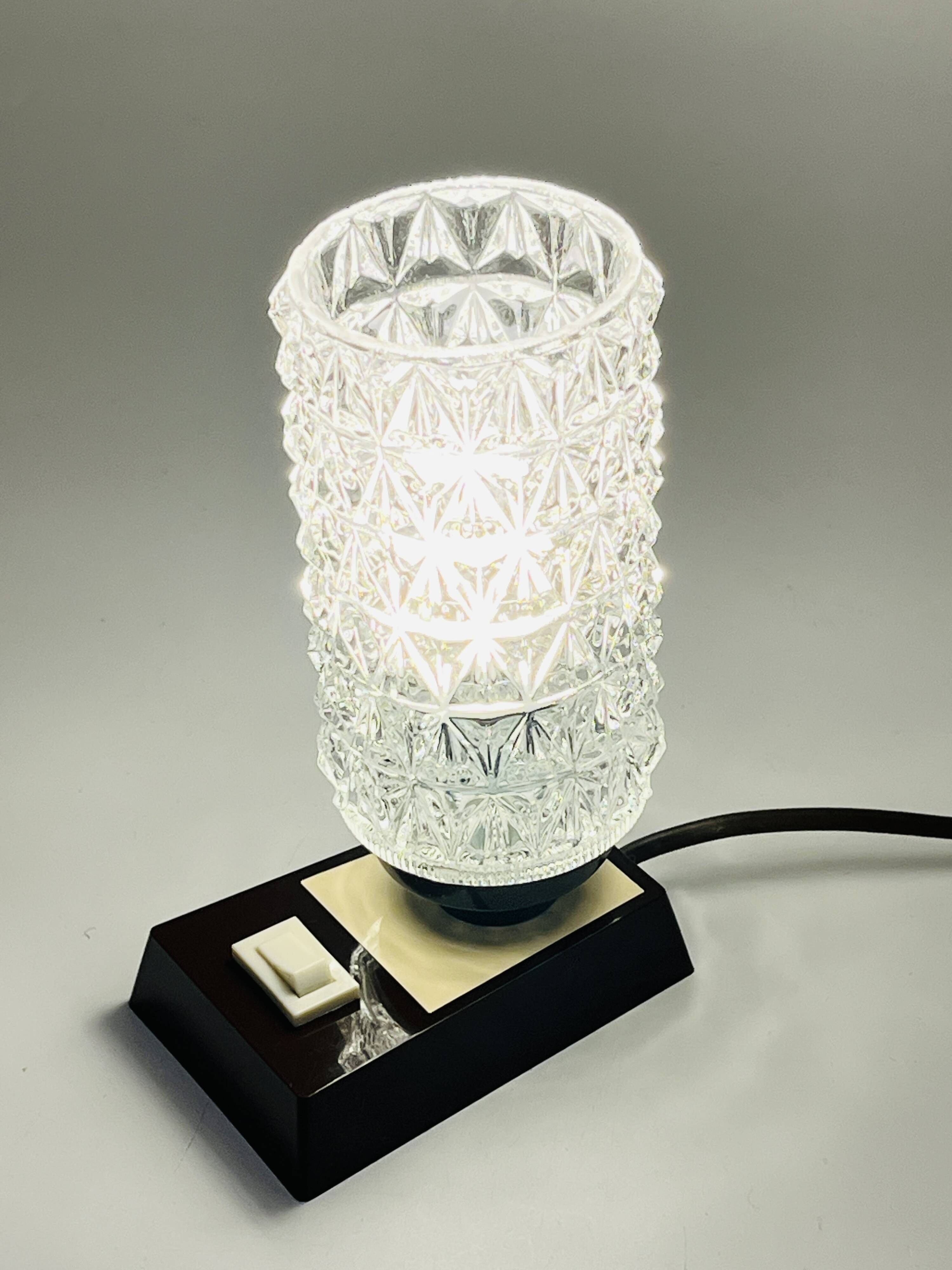 Massive bedside lamp in cut glass