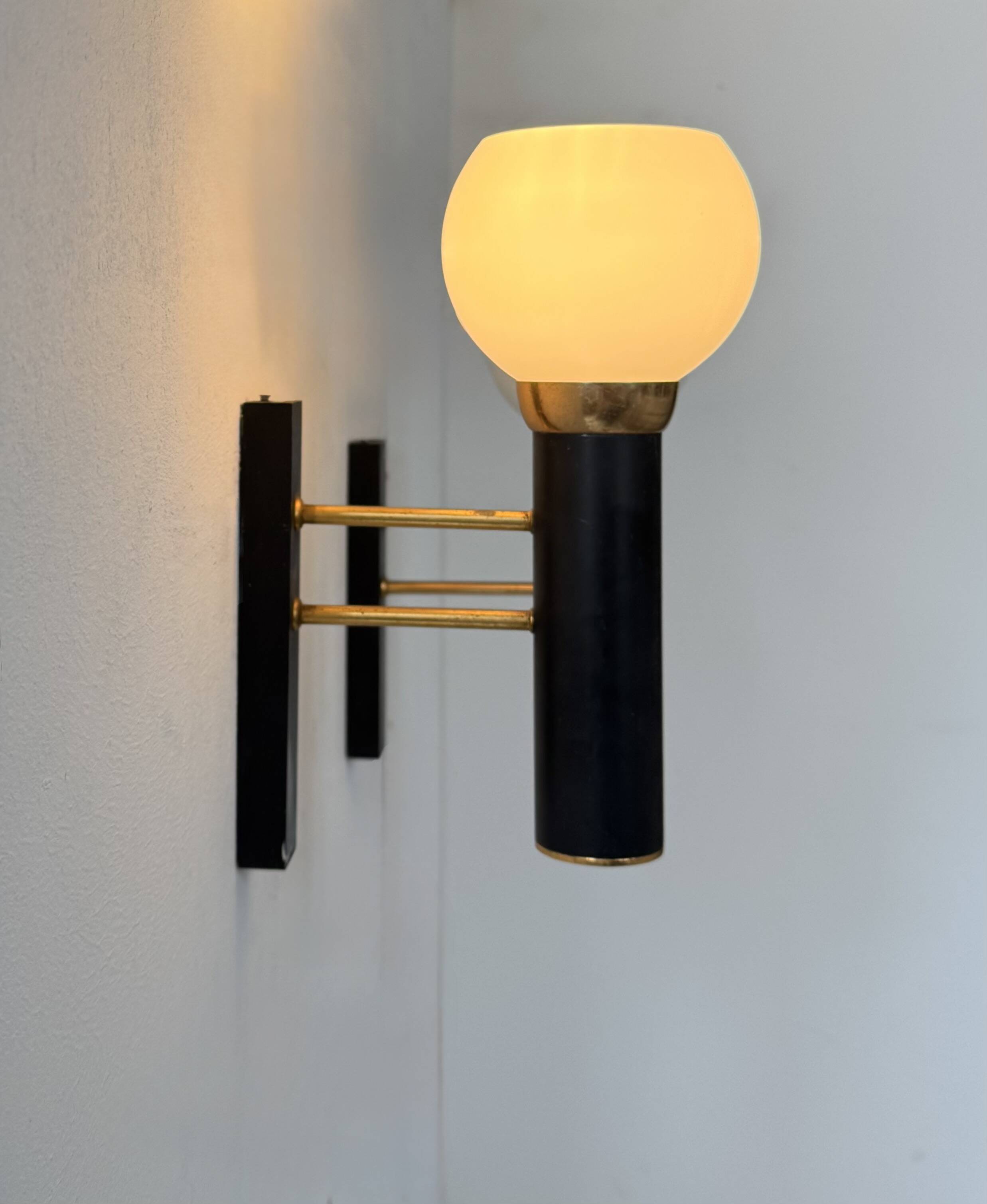 Pair of vintage wall lights, opaline brass and matte black metal, France, 1950