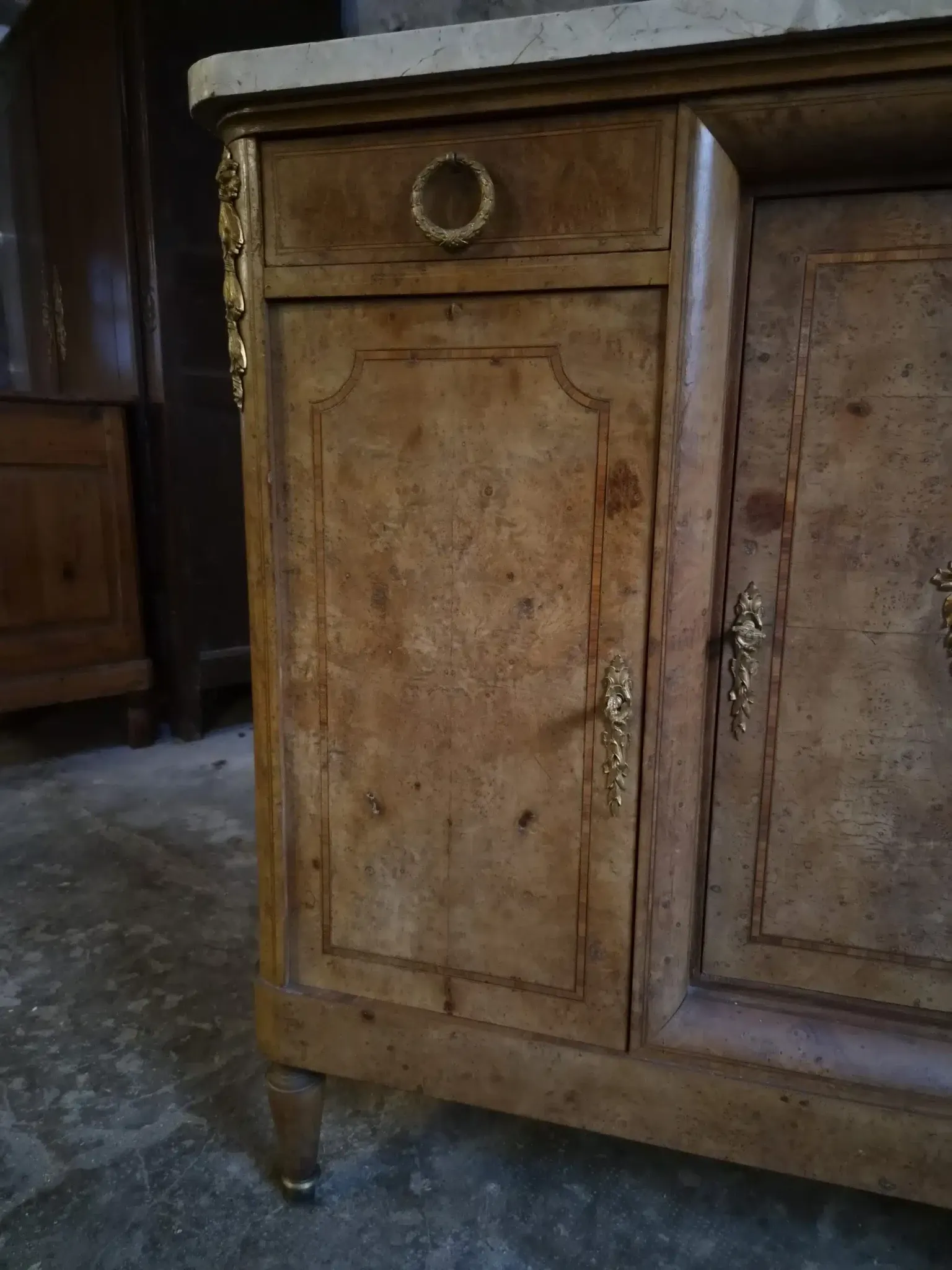Antique Louis XVI style buffet in burr elm with marble top, late 19th century.