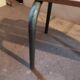 Former vintage wooden school bench and metal tubes