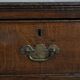 Antique English oak commode dating from the late 18th century.