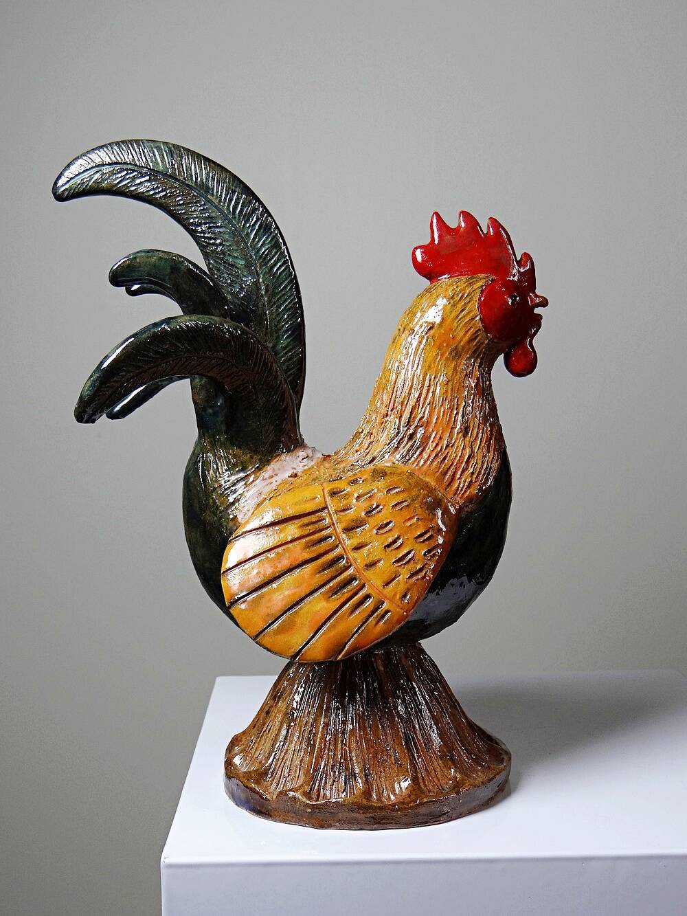Small decorative rooster in handcrafted enameled ceramic folk art
