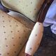 Louis Philippe style XIX century armchair with a violet backrest.
