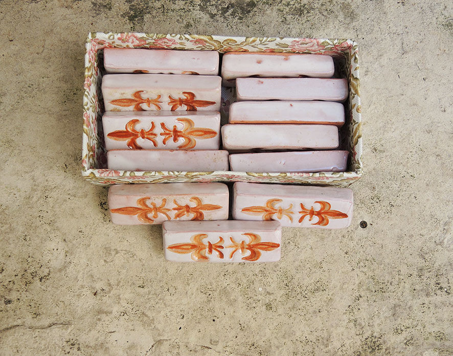 12 ancient fleur de lys knife holders in terracotta