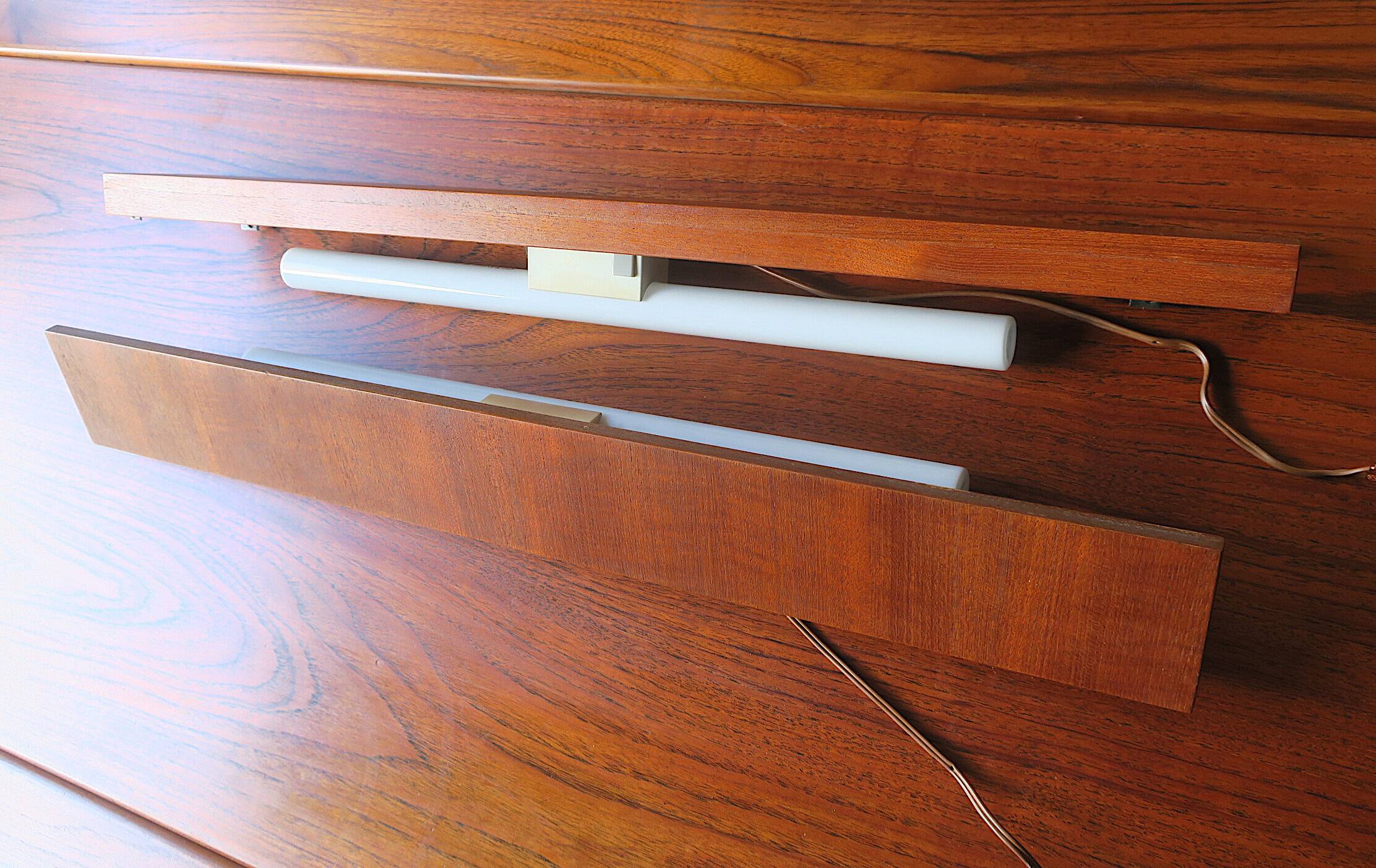 Pairb of Danish teak shelves with wall lights, 1960s