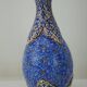 Piriform vase with a flared metal collar enamelled with a polychrome decoration, marked "Amini Iran" on the reverse.