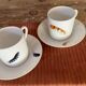 Two monastic porcelain cups