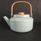 Teapot in enamelled tole green almond