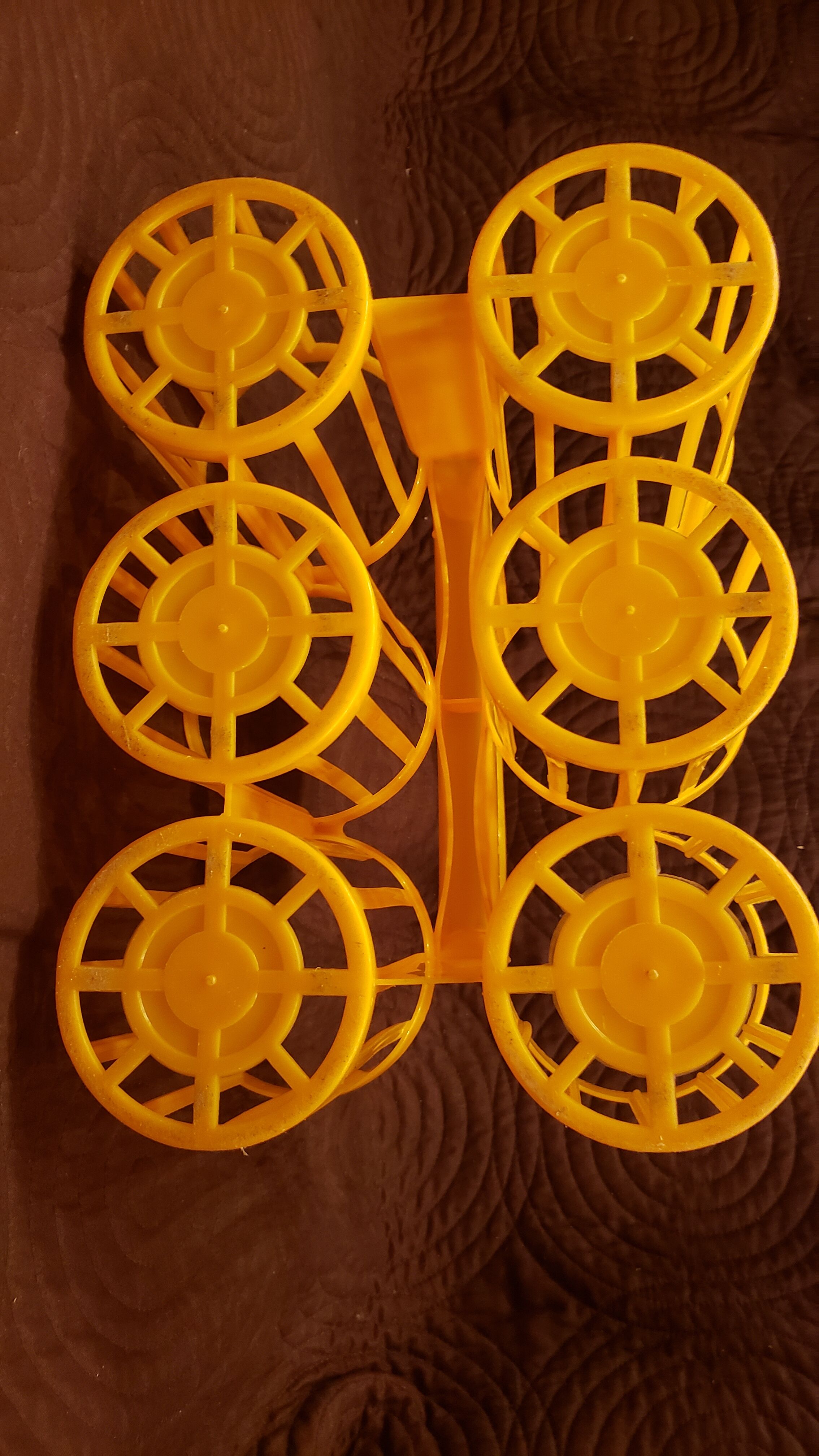 Vintage yellow plastic bottle holder