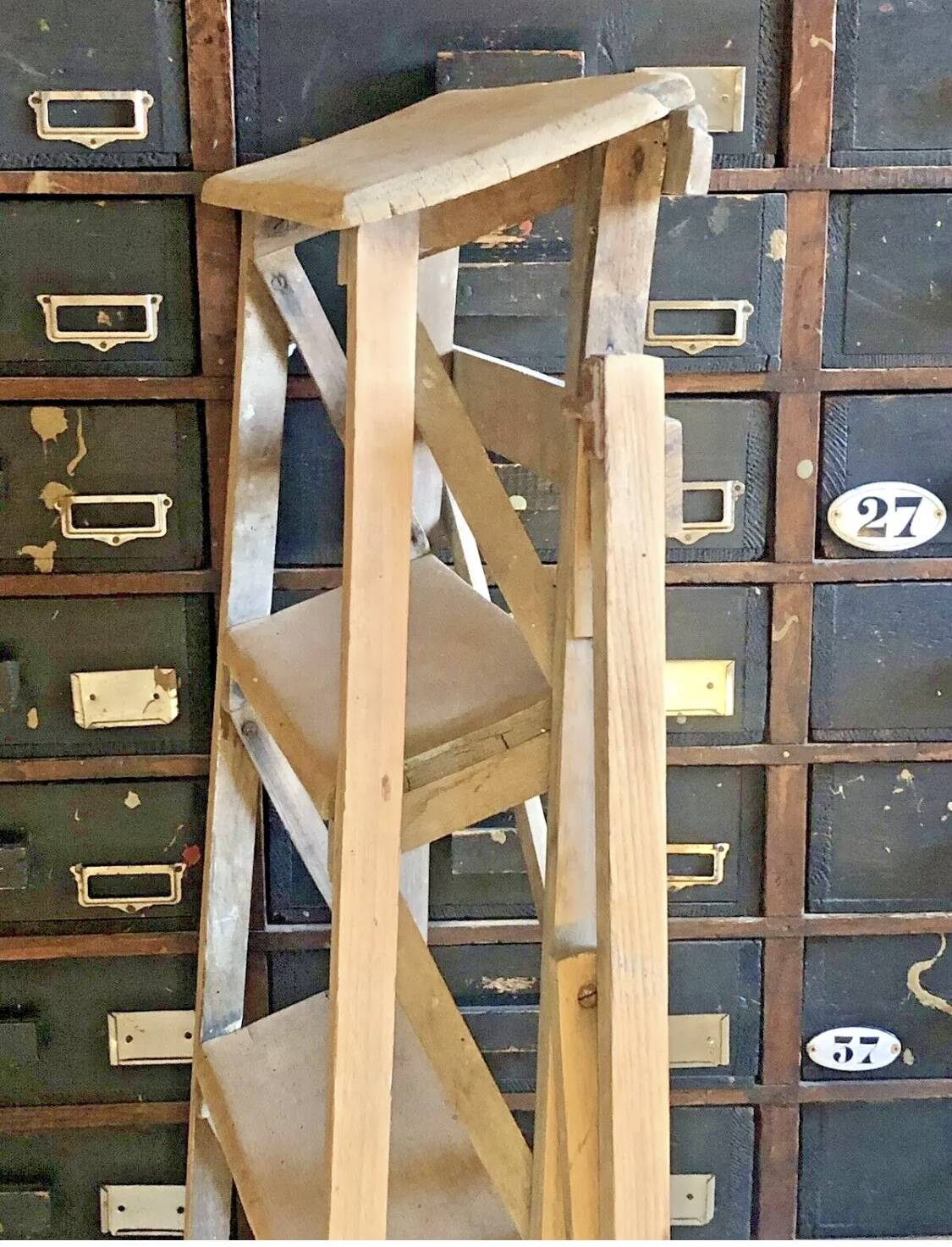 Old small painter's stepladder, wooden trade furniture, step stool