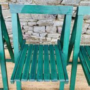 Set of 4 green folding chairs