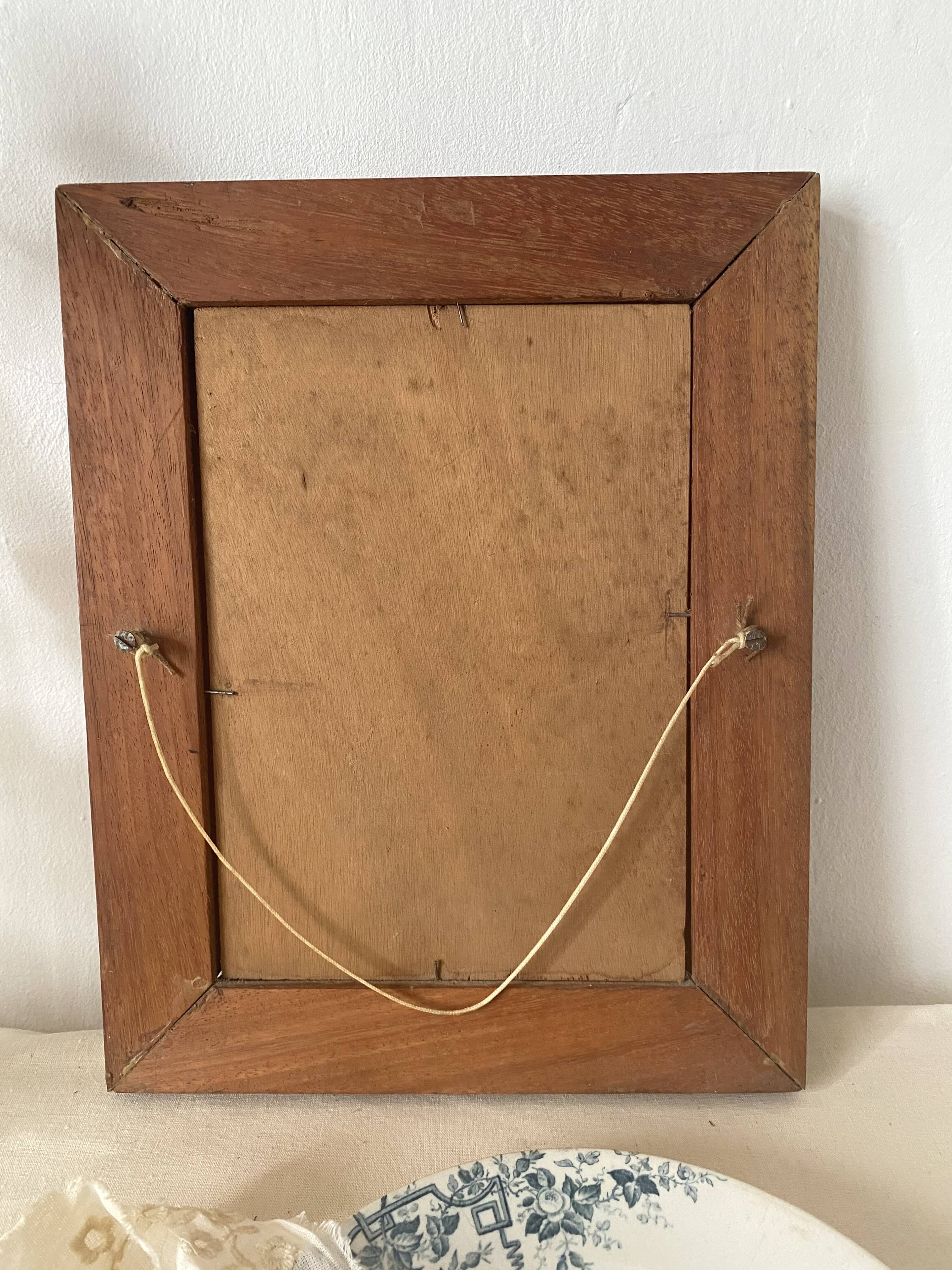 Old oil portrait on wood of a young woman