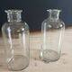 2 large antique transparent glass bottles