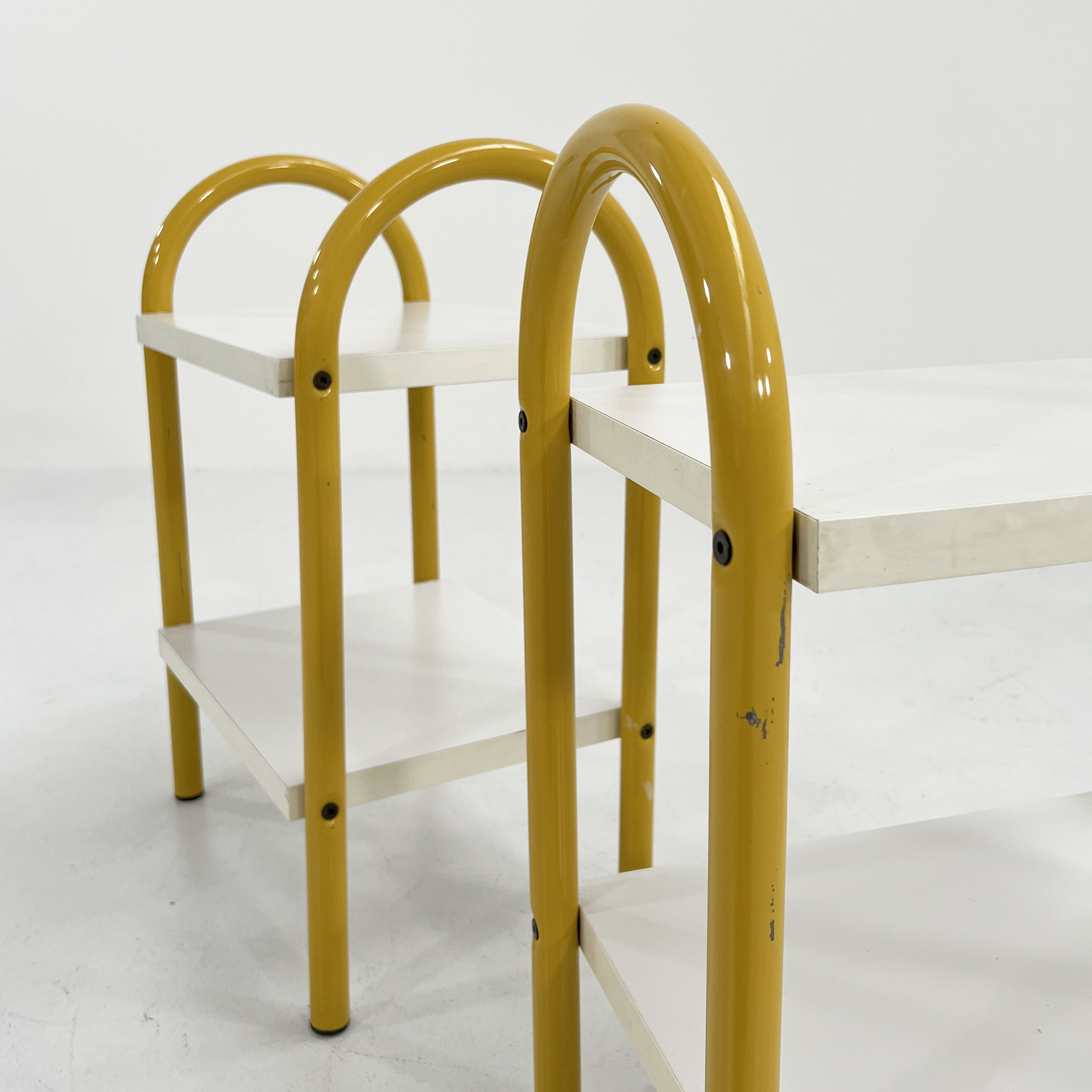 Pair of yellow tubular bedside tables, 1980