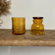 4 mismatched amber glasses
