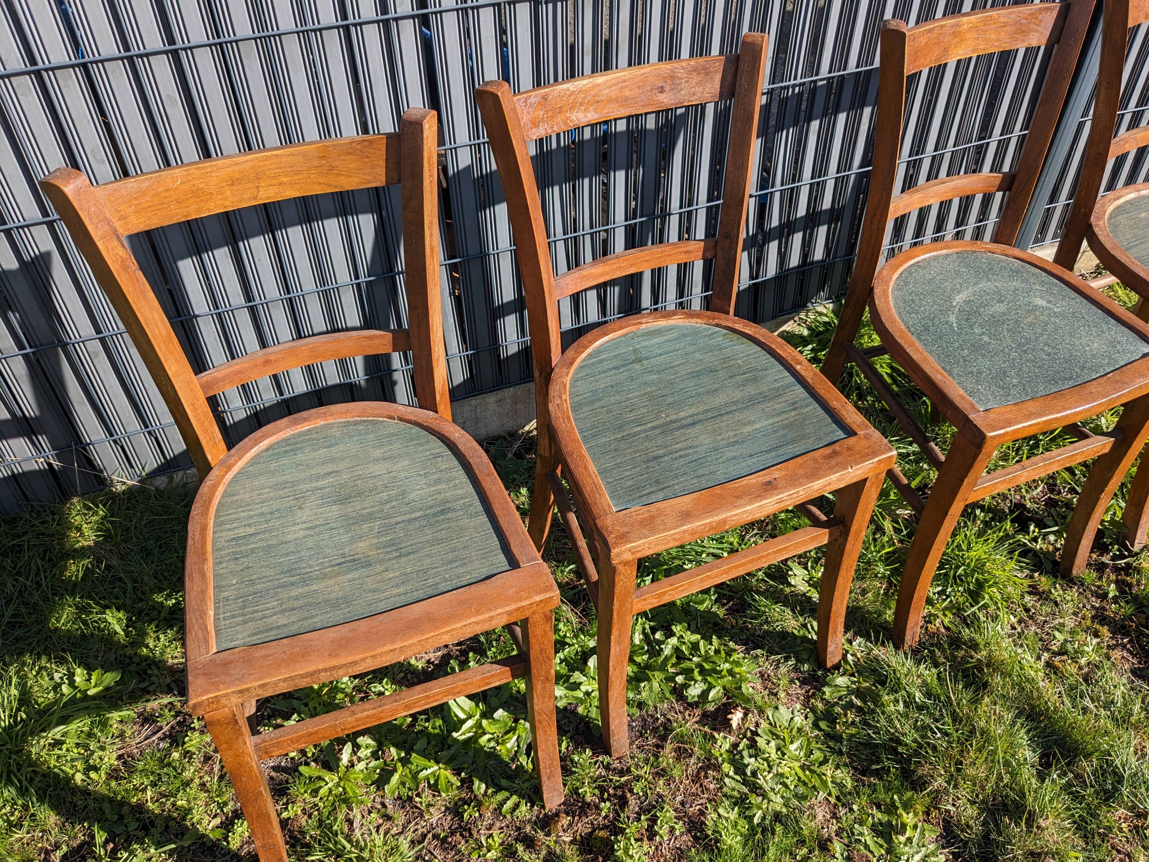 Set of four wooden bistro chairs, green seat, mid-20th century.