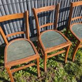 Set of four wooden bistro chairs, green seat, mid-20th century.