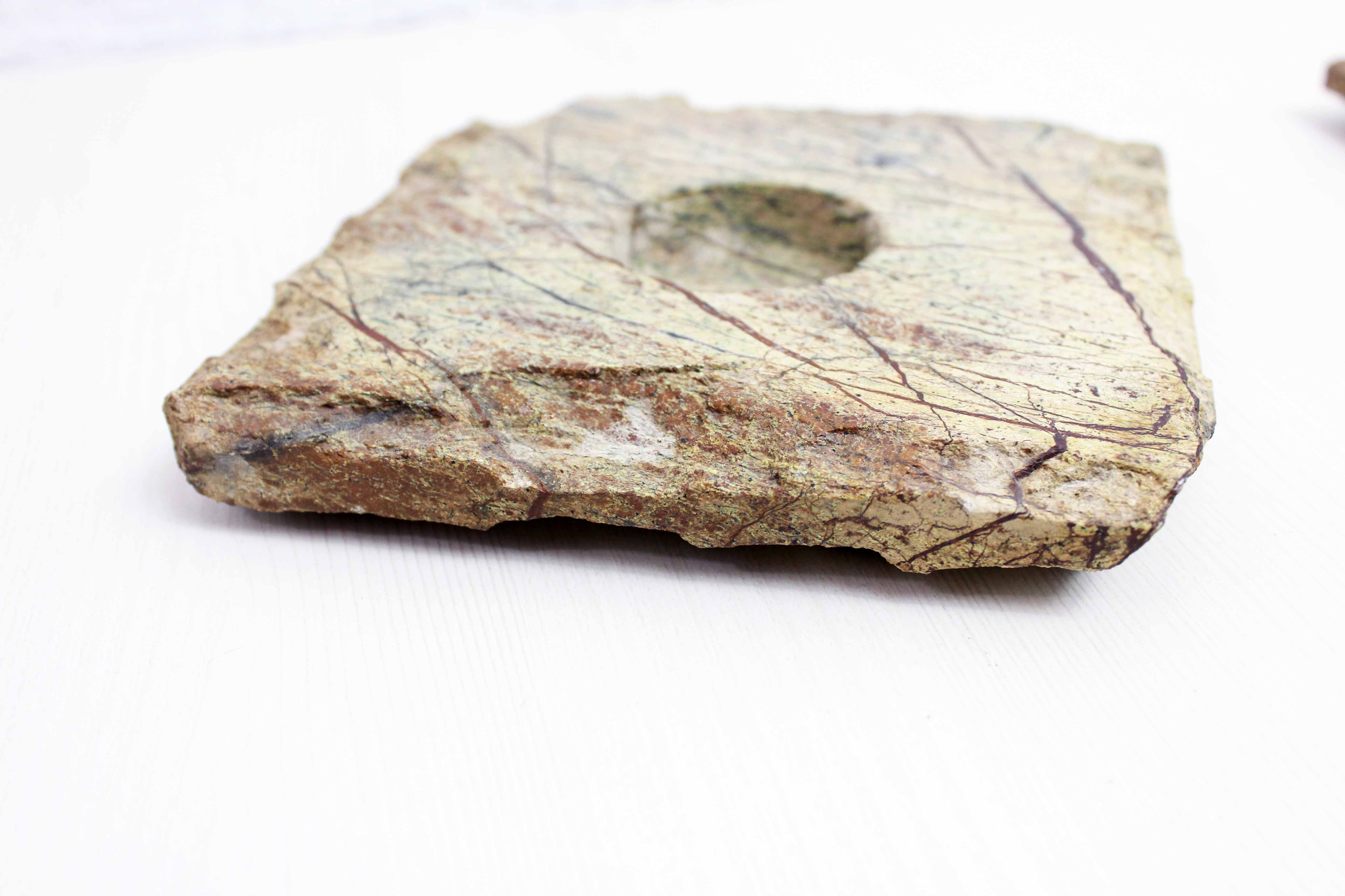 Pair of brutalist travertine candle holders