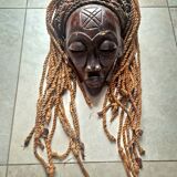 Chokwe Mwana Pwo mask in carved wood with a dark patina and rope hair