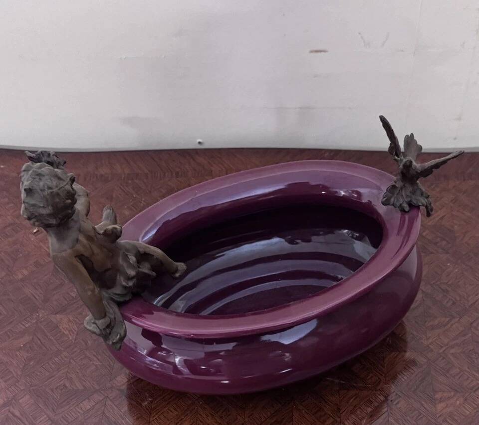 Catch-all or decorative bowl combining a ceramic container.