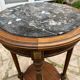 Old wooden pedestal table with marble top