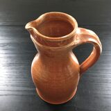 Signed pitcher in yellow ochre sandstone