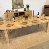 Oval farmhouse table in solid oak with extensions.
