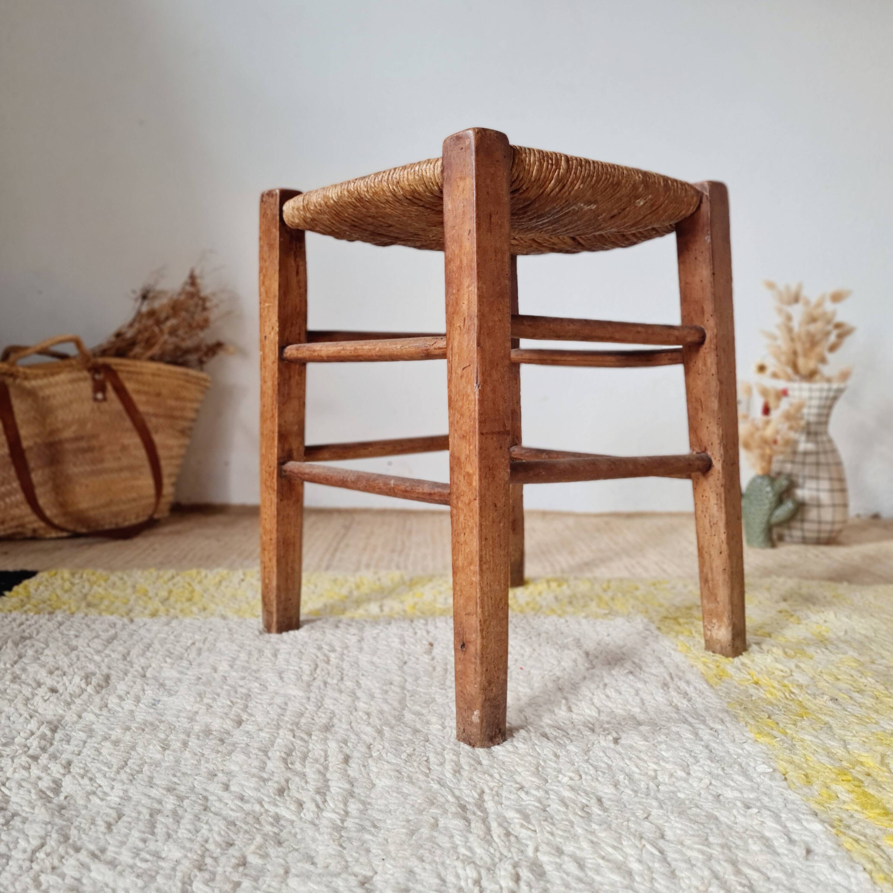 Old farmhouse stool made of wood and straw