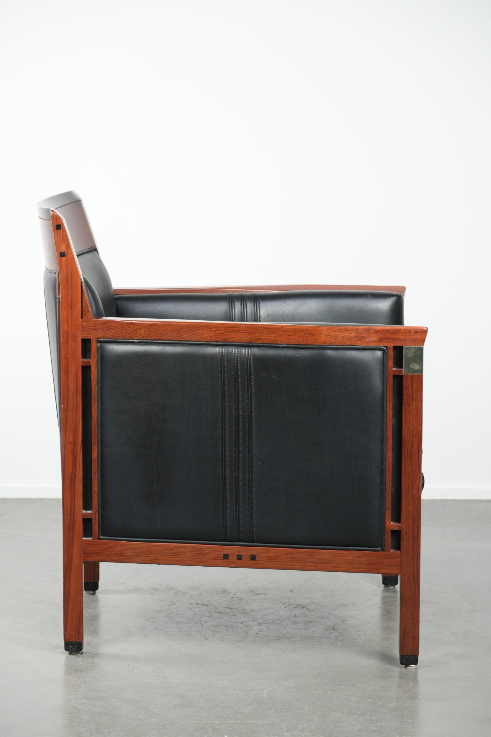 Black leather and wooden Art Deco design armchair